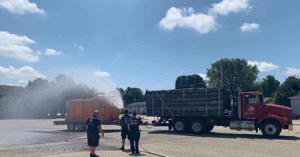 Green Bay firefighters rescue hive of bees using fire hose