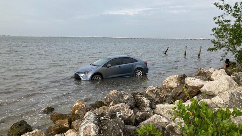 Car parked illegally on Florida beach flooded by high tide